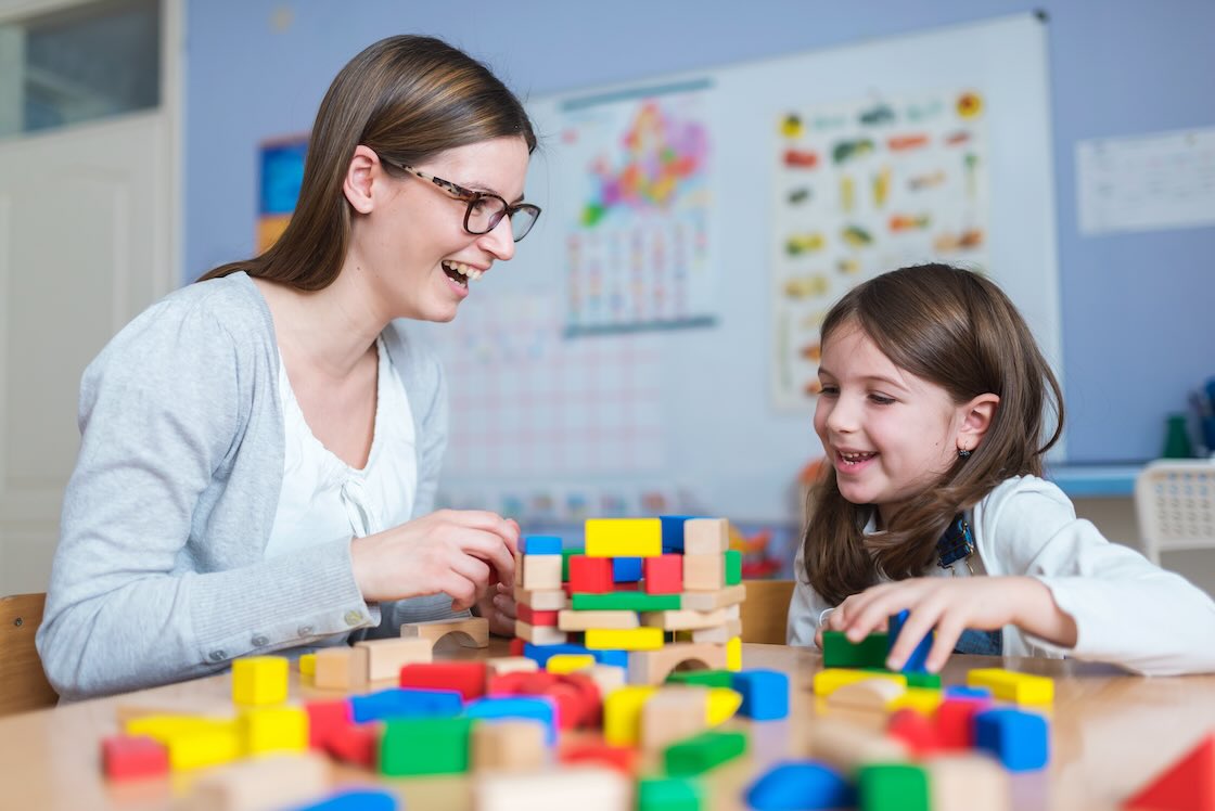 Childcare worker smiling about her childcare worker tax deductions